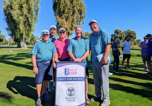 Golfers gathering during an adaptive golf partnership event supporting inclusive recreation opportunities